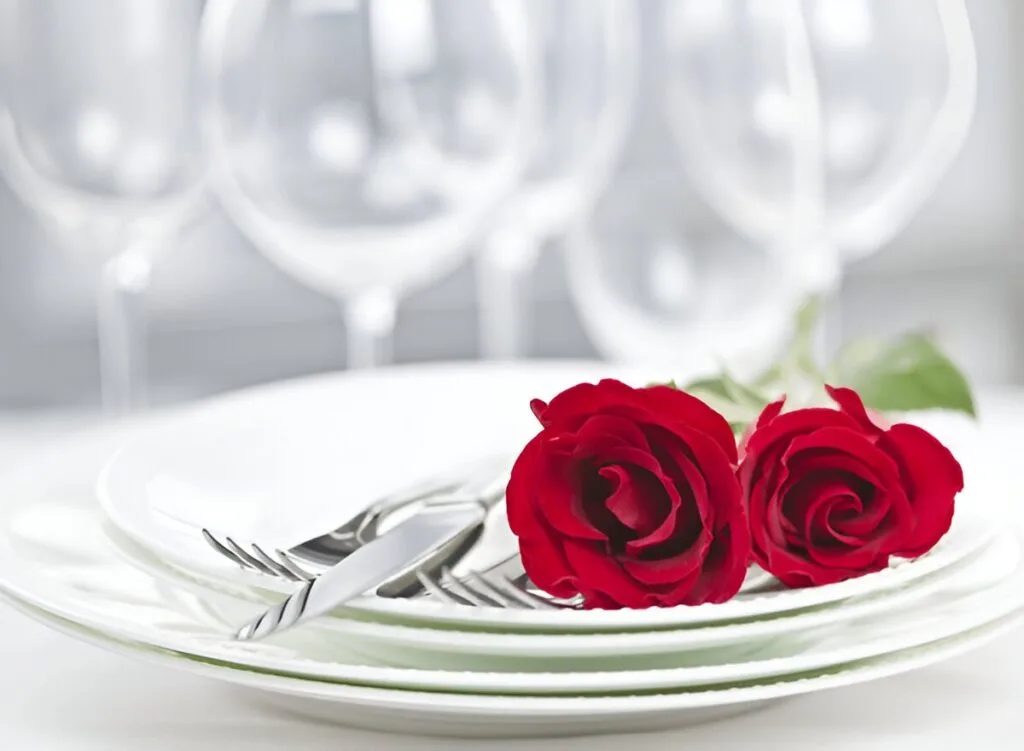 Representation of Best Picks of Flatware - a knife, fork and a pair of roses on plates