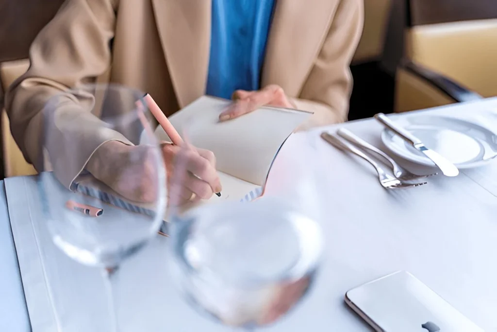 A person taking note of flatware inquiry