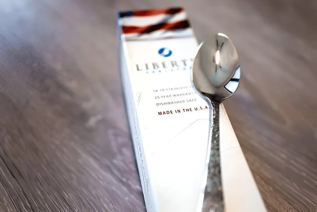 A Liberty Tabletop spoon kept on its individual pack
