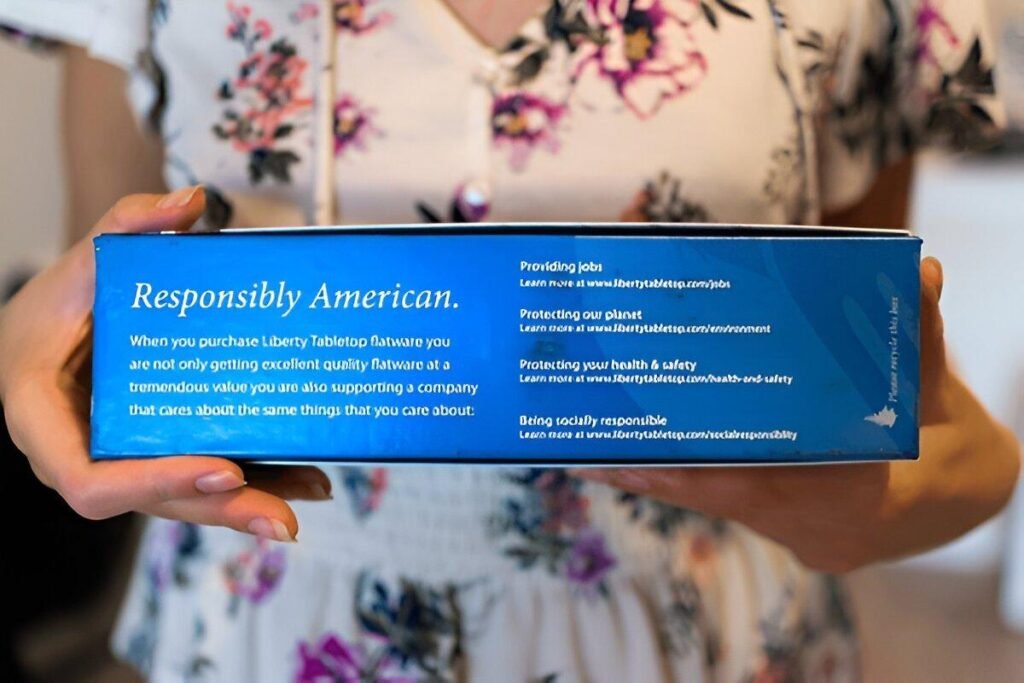 A lady holding a Liberty Tabletop pack with the inscription, Responsibily American