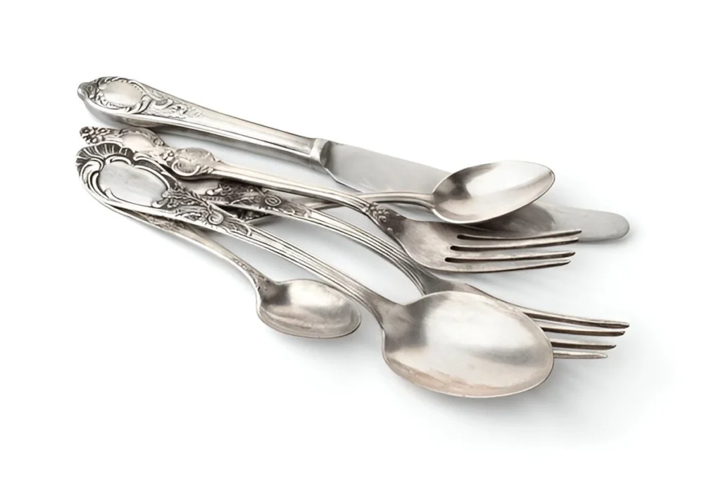 A few sterling silver forks, spoons and knives