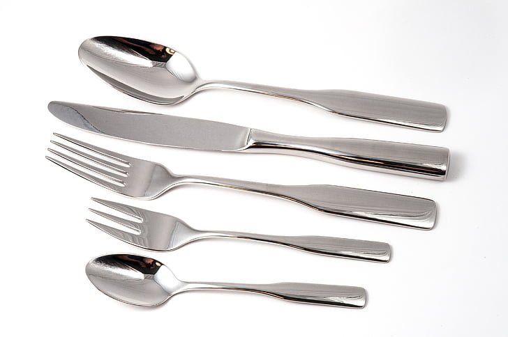 A 5-piece set of silver plated flatware