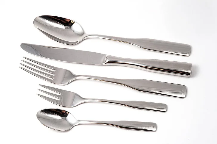 A 5-piece set of silver plated flatware