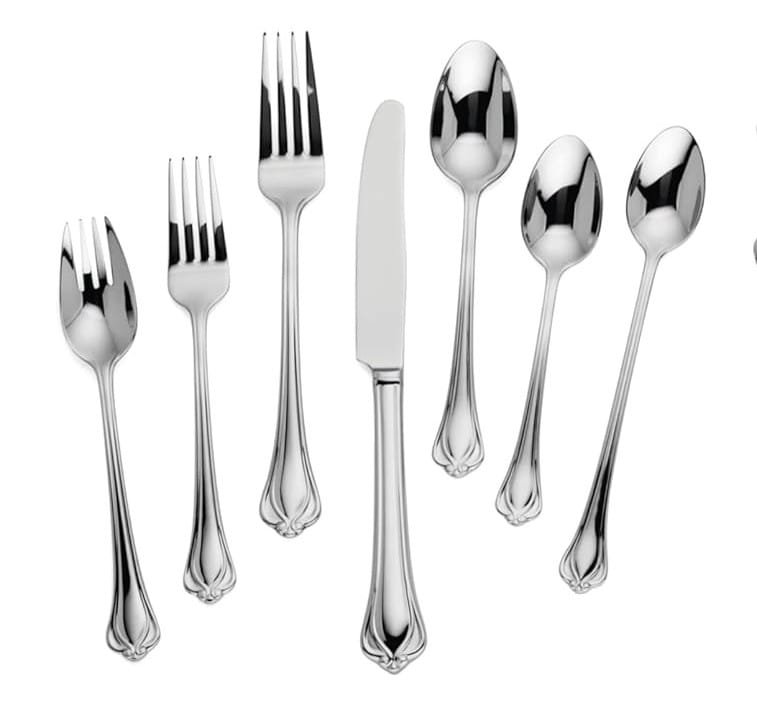 A 7 piece Lenox silverware set of Alcott pattern on a white background