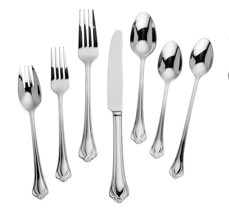 A 7 piece Lenox silverware set of Alcott pattern on a white background
