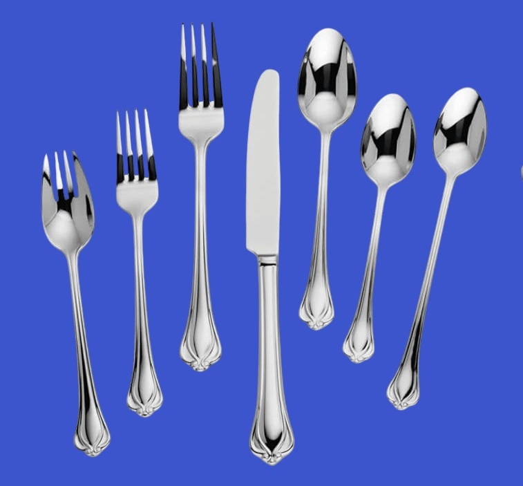A 7 piece Lenox silverware set of Alcott pattern on a blue background