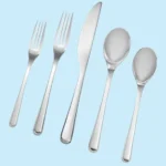 A Nambe silverware set from the Aura collection