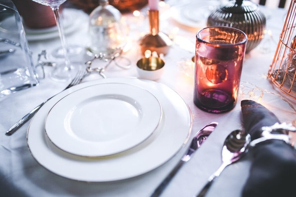 Table setting with polished silverware for a fomal dinner