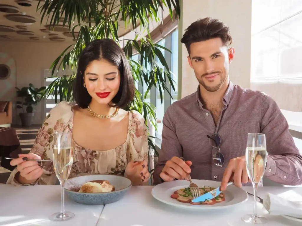 A couple using towle silverware set
