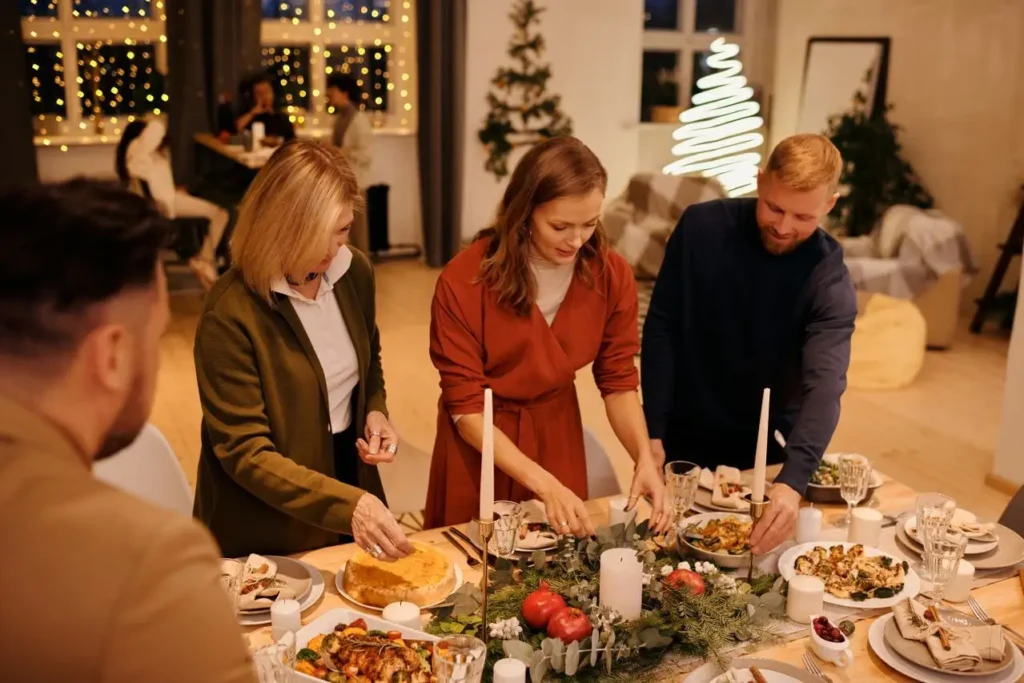 Hosts are setting Godinger silverware set on a table