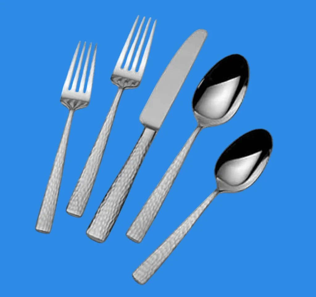 A 5 piece place setting of Mikasa Oliver hammered flatware