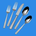 A 5 piece place setting of Mikasa Oliver hammered flatware