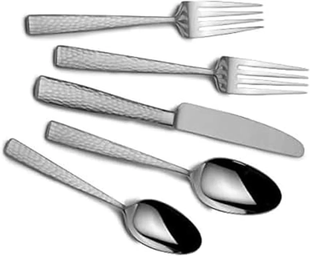 A 5 piece place setting of Mikasa Oliver hammered silverware