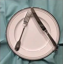 Knife and form positions during pause of eating.